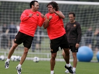 Puyol, Xavi and Iniesta get training