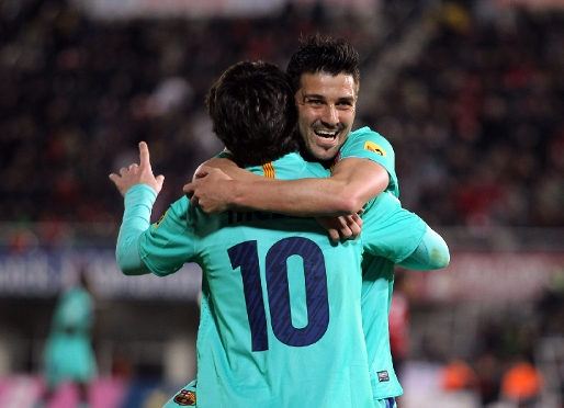 Villa y Messi celebran uno de los tres goles en Son Moix. Fotos: Miguel Ruiz (FCB)