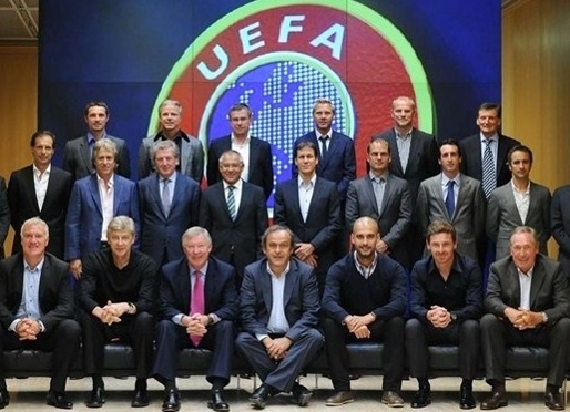 Guardiola amongst other coaches at UEFA forum