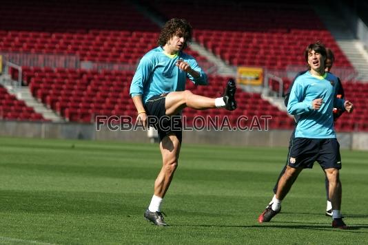 Carles Puyol warming up. Bojan on his right.