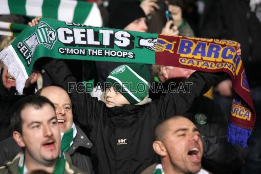 A young Scottish fan with a scarf in the colours of Celtic and Bara.
