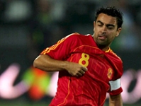 Xavi and Iniesta on song for Spain