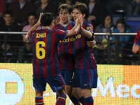 Xavi, Bojan y Messi celebrando un gol ante el Villarreal. Foto: Miguel Ruiz-Alex Caparrs.