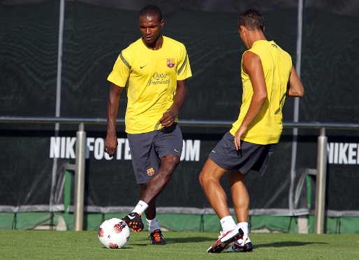 Abidal y Afellay, durante el entrenamiento de este martes por la tarde. Fotos: Miguel Ruiz-FCB